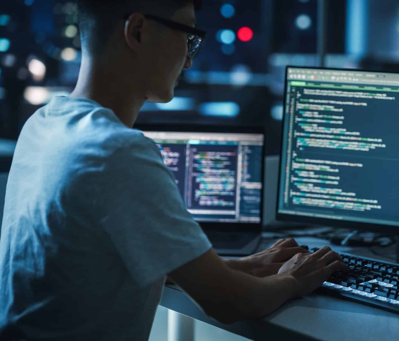 Night,Office:,Young,Handsome,Man,In,Working,On,Desktop,Computer.